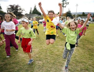 Two girls show off for the camera during the 13th annual walkathon at Fall City Elementary School.