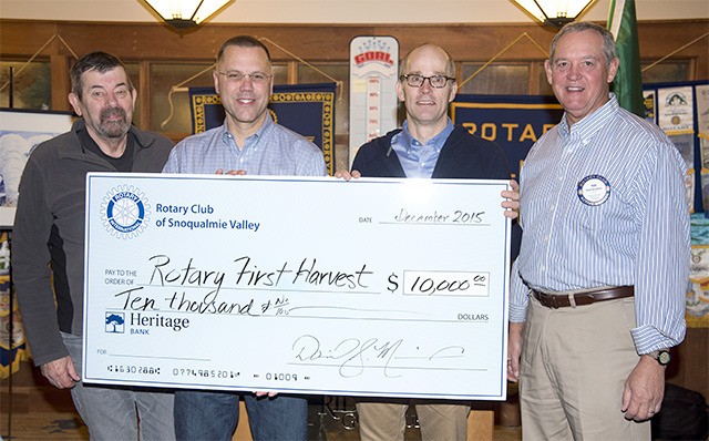 Rotary officials making a $10