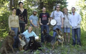 Left Coast Gypsies band and crew members gather with family members in this photo from the band’s Facebook page. The dogs are there “just for giggles