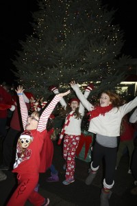 Young dancers from Ignite Dance and Yoga whirl around the newly lit North Bend Christmas tree at the 2014 festival.