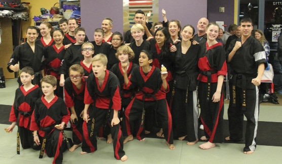 DMW Martial Arts students recently awarded their black belts gather in celebration.