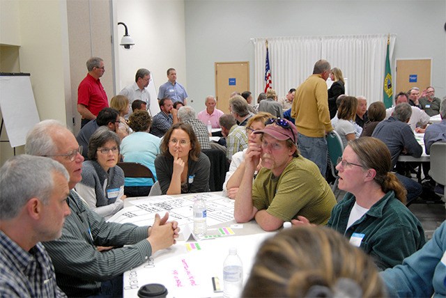 At tables of about 10 people each