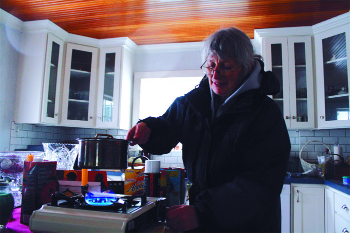 Marietta Modl cooks with propane during power outage in January of 2012. The Snoqualmie resident heated her home with a butane burner