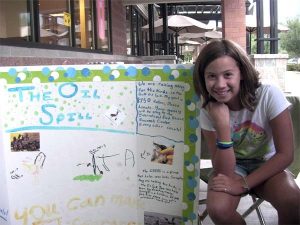 Showing off her booth and bracelet creations at North Bend Safeway