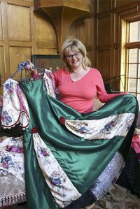 Denise Stone holds a gown she created for an April 18 Civil War ball at Sallal Grange.