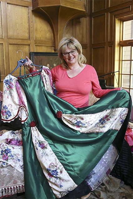 Denise Stone holds a gown she created for an April 18 Civil War ball at Sallal Grange.