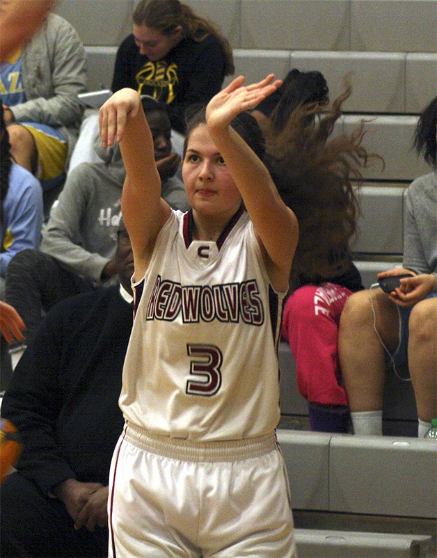 Cedarcrest senior Megan Ditore looses a long shot against the Highlanders Dec. 20. She led scoring in the contest.