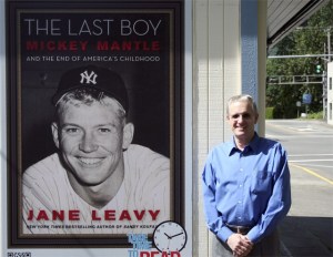 North Bend insurance agent Hugh Reichenbach proudly promotes literacy