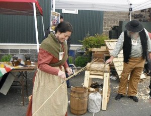 Re-enactors from the Fort Nisqually Time Travelers demonstrate making three-ply rope