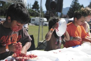 Children attempt to speed-devour cherry pies in the messiest part of North Bend's annual Festival at Mount Si