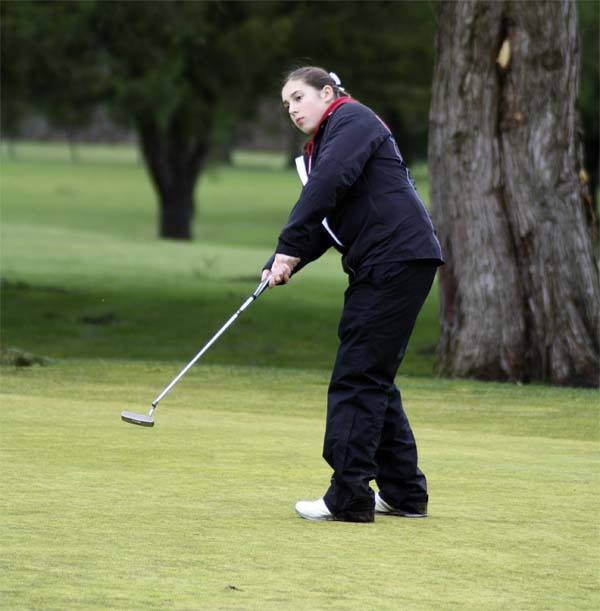 Mount Si freshman Tabitha Dorn hits on the green during play against Sammamish