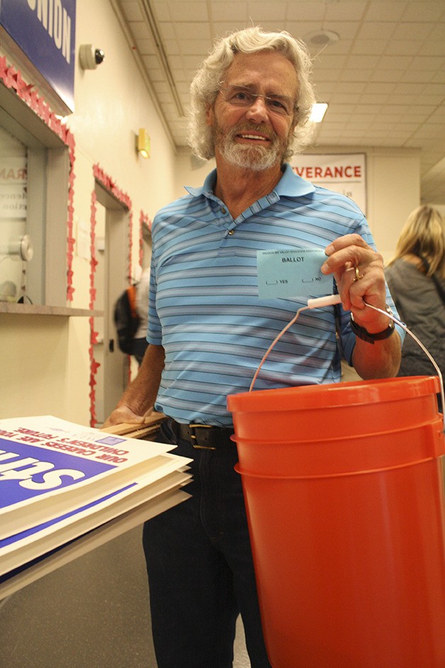 Snoqualmie Valley School District teacher Jack Webber holds his ballot with one hand