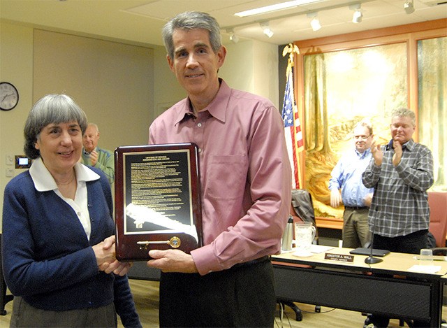Mary Norton receives hearty applause as Snoqualmie Mayor Matt Larson presents her with a key to the city for a lifetime of achievement.