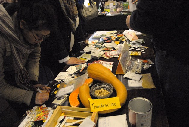Visitors explore the offerings at the 2013 seed exchange. Transition brings the event back this weekend.