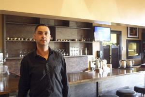 Caadxi Oaxaca owner Francisco Romo poses at the bar of his new restaurant in downtown Snoqualmie. The restaurant serves traditional family favorites from southern Mexico.