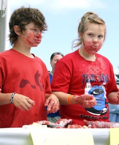 Pie gorgers Chase Roeder and Tessa Lewis show their messy game faces at the 2011 cherry pie eating contest