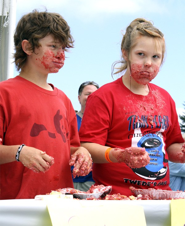 Pie gorgers Chase Roeder and Tessa Lewis show their messy game faces at the 2011 cherry pie eating contest