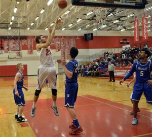 Mount Si Wildcat Taylor Upton pushes through the Bothell defense to take a shot