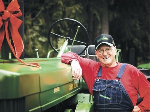 Posed with one of his favorite John Deeres