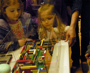 Molly Schlotfeldt and her big sister Josie watch one of the most popular experiments of the Fall City science fair
