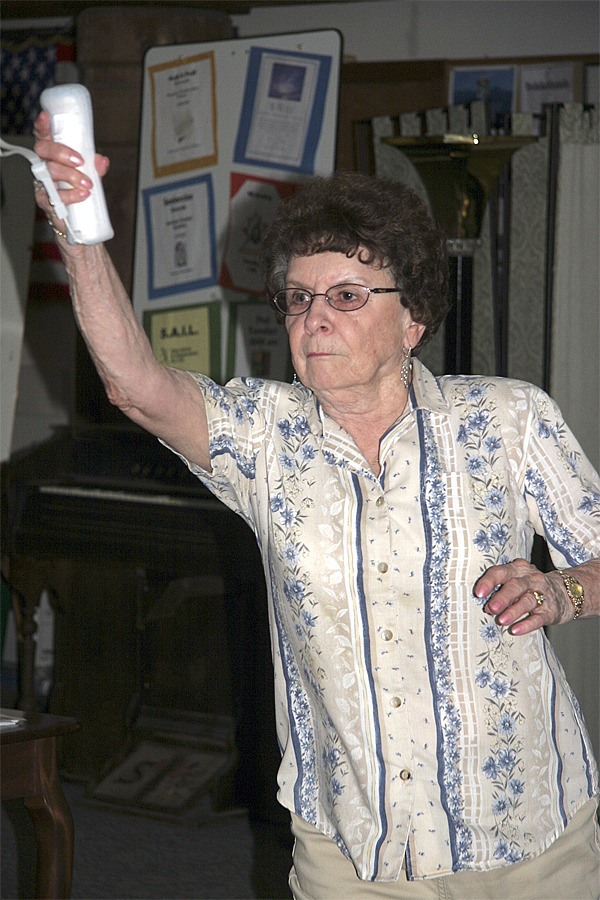 North Bend resident Betty Edens ‘releases’ a virtual bowling ball during practice by the Mount Si Senior Center’s Wii bowling team.