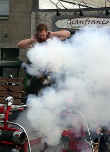 Seafair Pirate Arnie Stray fires a small but noisy cannon during the Railroad Days parade