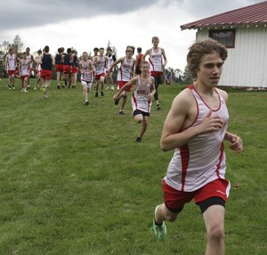 The Mount Si boys cross country team warms up prior to their Sept. 25 trek across Mountain Meadows Farm