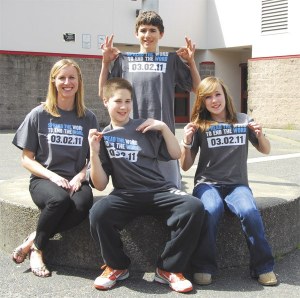 Showing off T-shirts for the “Spread the Word to End the Word” campaign are
