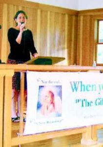 Group gathers to sing a song with a message