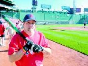 Resident swings for the fences in cancer fund-raising event