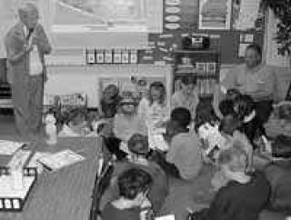 Grange hands out dictionaries