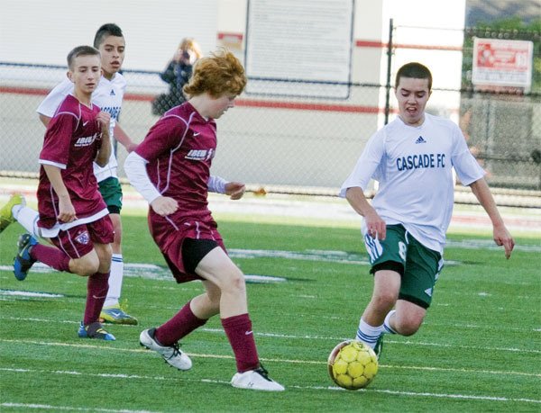 Mason McRae of Cacade FC’s U-14 boys moves the ball during play against Tyncastle.