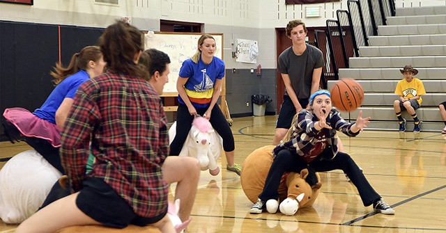 Junior Kelsey Berens reaches for the pass in an early match of the Donkeys vs Unicorns basketball tournament at Cedarcrest High School Thursday.