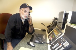 Answering a caller's questions about impending floodwaters