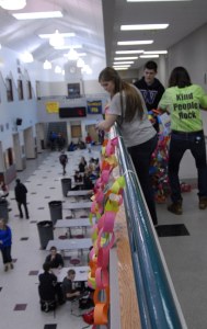 Random Acts of Kindness Club members capped off a week of random acts of kindness at Cedarcrest High School and in the surrounding community by hanging a long “kindness chain” from the balcony over the Cedarcrest commons. Club president Maggie Gronberg