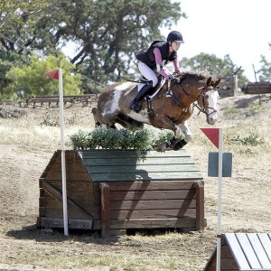 Sophia Click and Hot Wheels clear a jump in a qualifier for national competition this weekend.
