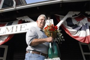 Northwest Railway Museum volunteer Dan Olah waters flowers at the Snoqualmie Depot. Olah is one of a core of dedicated helpers making sure Railroad Days and the museum's mission comes off smoothly.