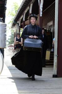 Cast members of 'You can't win' traverse the platform at the Northwest Railway Museum in Snoqualmie during filming of the independent production