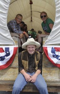 A covered wagon makes an ideal float for the 2014 Carnation Fourth of July parade.