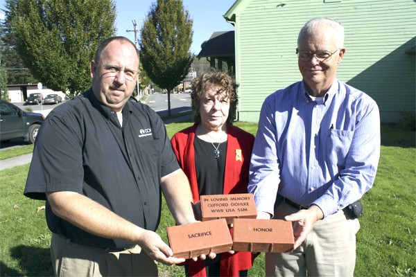 Hefting bricks for the new monument plaza in Snoqualmie