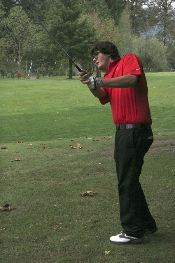 Connor Landry hits onto the green during an early-season showcase at Mount Si Golf Course.
