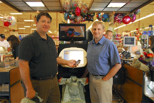 QThru CEO Aaron Roberts with Phil Stafford