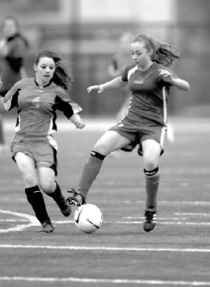 Alyssa Proudfoot works the ball around Chief Kanims Kenzie Parker in last weeks Battle of the Birds. Snoqualmie Middle School won the contest 3-0.