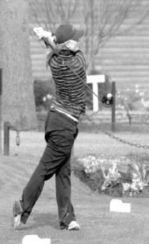 Katie Somers tees off in action against Issaquah last week. Despite shooting a 40