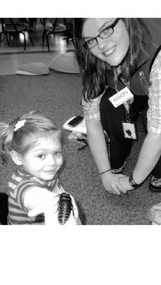 Chelsey Hineman of Snoqualmie holds a live Madagascar hissing cockroach