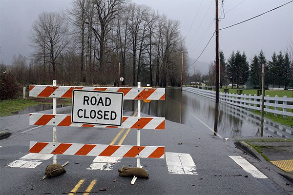 Southeast Part Street was flooded along the stretch of road that bordered Centennial Fields Park.