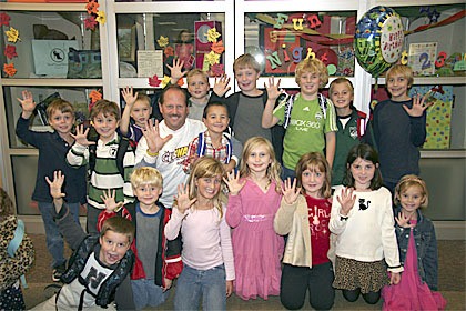 Holding up raised five-finger signs