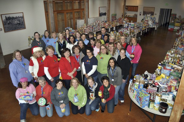 Thirty-four Encompass staff and one former board member gather Thursday