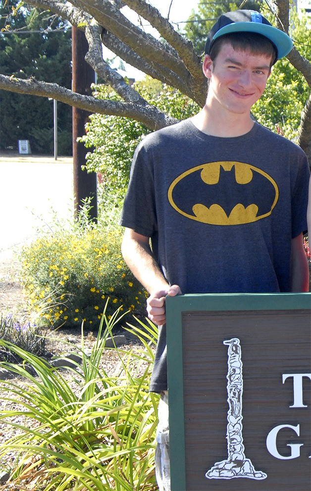 Dwight Rose is the Eagle Scout candidate who put together the new sign introducing Fall City's Totem Garden.