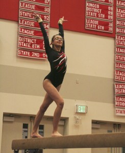 Mount Si sophomore Elizabeth Holmes performs her beam routine Thursday evening